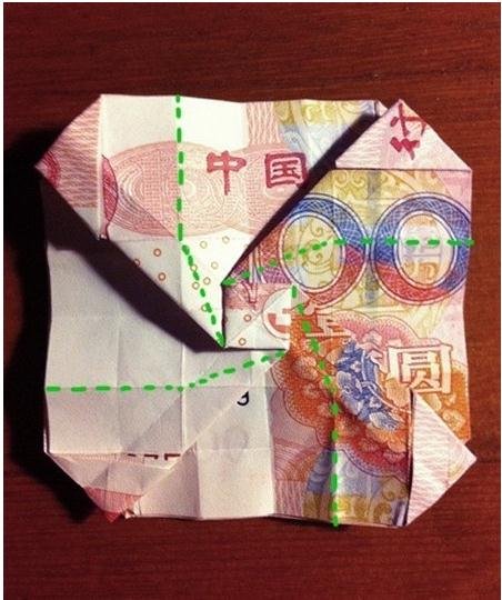 折玫瑰花成了大家心仪的对象，怎样用钱折玫瑰花呢？